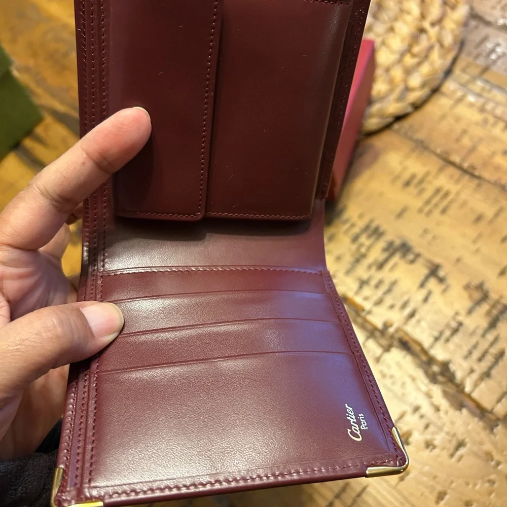 Cartier Deep Burgundy Leather bifold Gold Corner Hardware